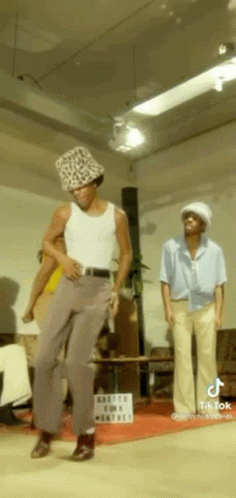 Man In Leopard Print Hat Dancing With Two Men GIF