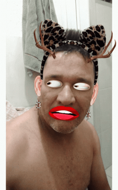 Man In Leopard Print Headband With Antlers GIF