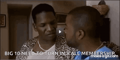 Man In Leopard Print Jacket Talking To Another Man In Living Room GIF