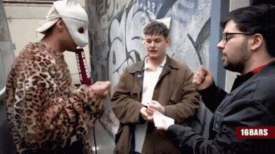 Man In Leopard Print Jacket Talking To Two Men With 16Bars Logo GIF