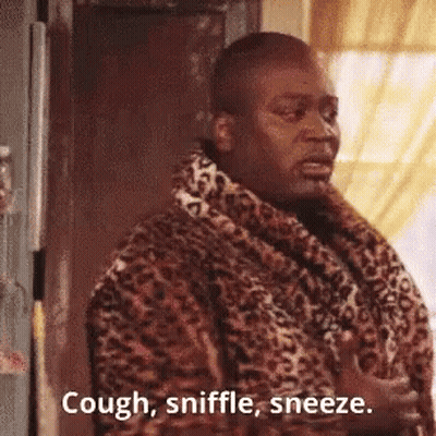 Man In Leopard Print Robe Sneezing At Door GIF