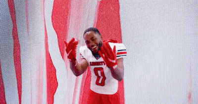 Man In Liberty Football Jersey In Front Of American Flag GIF