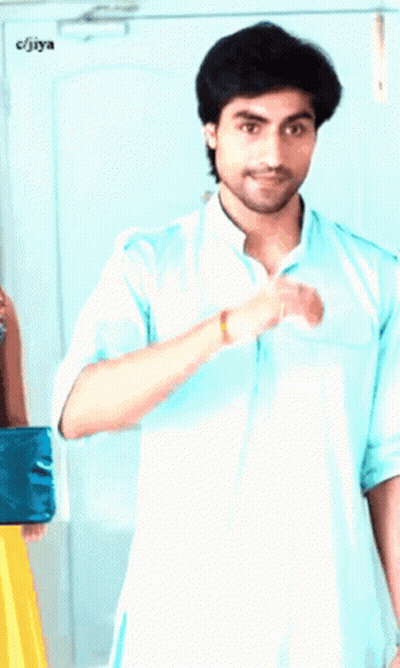 Man In Light Blue Shirt Next To Man In Blue Shirt And CJIYA Sign GIF