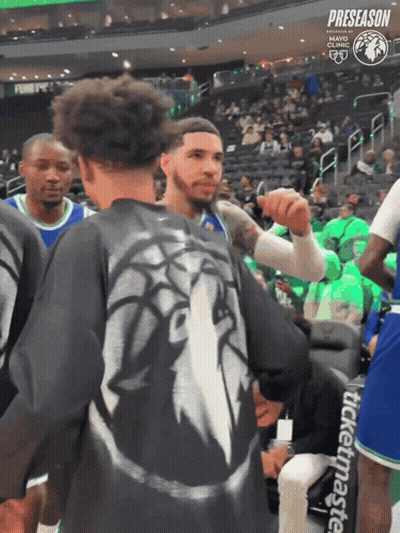 Man In Lion Shirt Talking To Another Man GIF