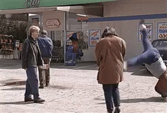 Man In Little Coat Standing With Arms Out GIF