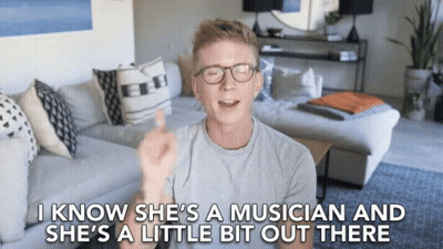Man In Living Room Saying She's A Musician GIF