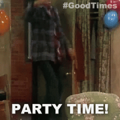 Man In Living Room With Balloons Saying Party Time GIF
