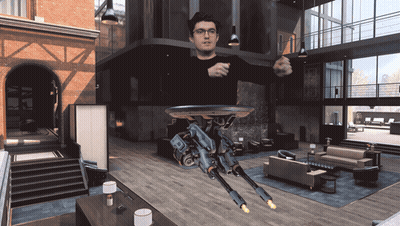 Man In Living Room With Flying Robot GIF