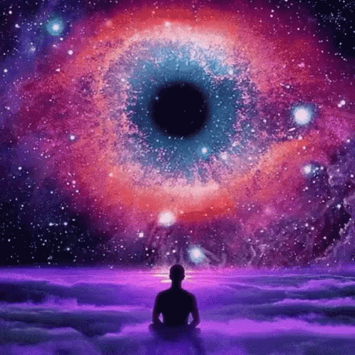 Man In Lotus Position In Front Of Huge Eye In Galaxy GIF