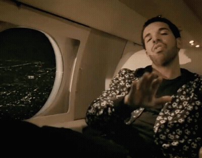 Man In Louis Vuitton Jacket Sitting In Plane GIF