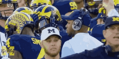Man In M Hat With Football Team GIF