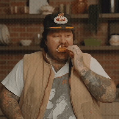Man In Mack Hat Eating Chicken Wing GIF