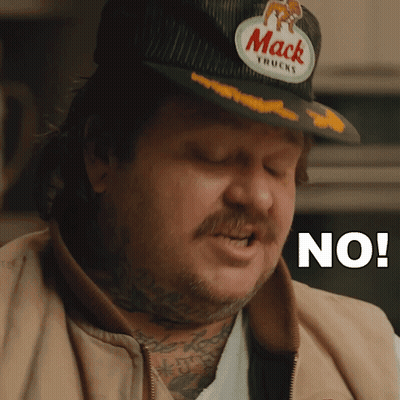 Man In Mack Truck Hat Saying No GIF