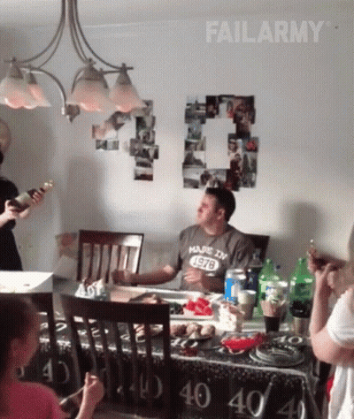 Man In Made In 1978 Shirt Sitting At Table GIF