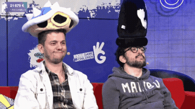 Man In Malibu Hoodie On Red Couch GIF
