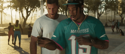 Man In Manatees Jersey Looking At Cell Phone GIF