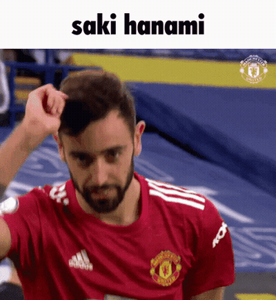 Man In Manchester United Shirt Scratching Head GIF