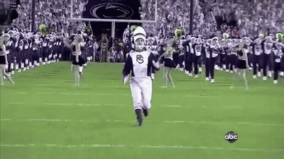 Man In Marching Band Uniform Running On Field GIF