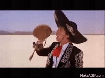 Man In Mariachi Outfit Holding Fan GIF