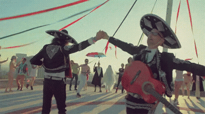 Man In Mariachi Outfit Holding Hand Guitar GIF