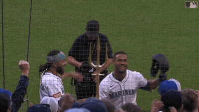 Man In Mariners Jersey Holding Helmet GIF