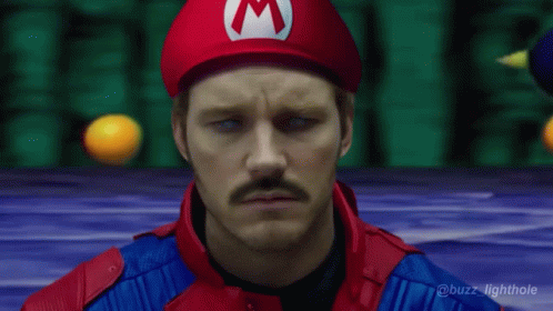 Man In Mario Costume With Red M Hat GIF