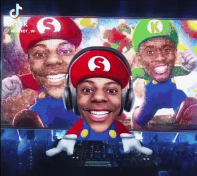 Man in Mario Hat Wearing Headphones Smiling
