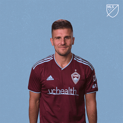 Man In Maroon Adidas Shirt With UCHealth GIF