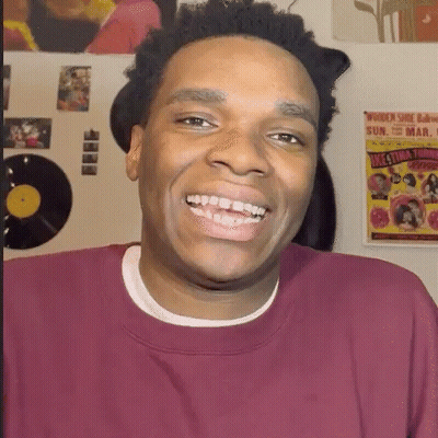 Man In Maroon Shirt Smiling At Women Shoe Bar GIF