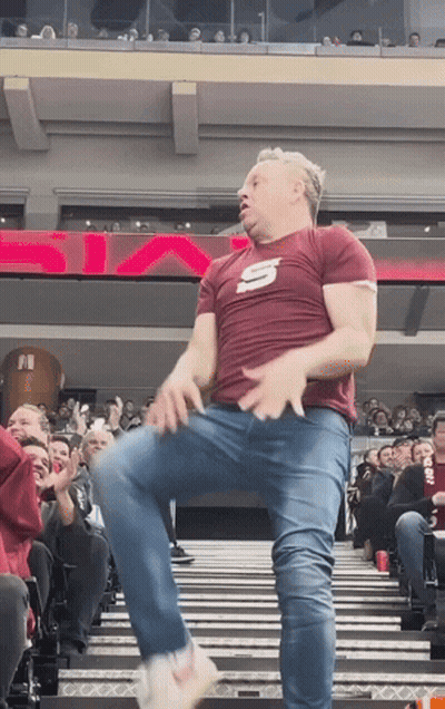 Man In Maroon Shirt With Letter S Dancing GIF