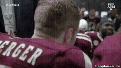 Man In Maroon Shirt With Name Roger On Back GIF