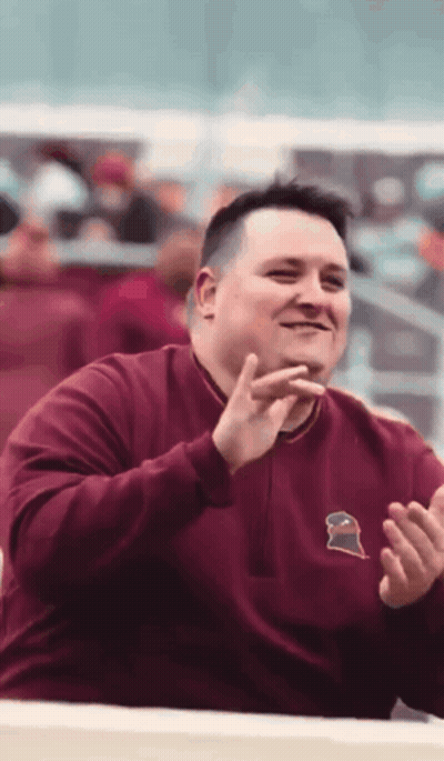 Man In Maroon Sweatshirt With Gator GIF