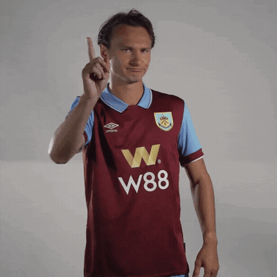 Man In Maroon W88 Jersey Pointing Up GIF