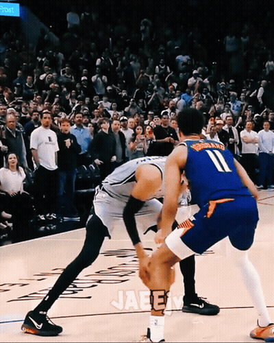 Man In Mascot Costume Standing Next To Mascot GIF