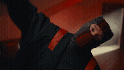 Man In Mask And Black Jacket Smoking Cigarette GIF