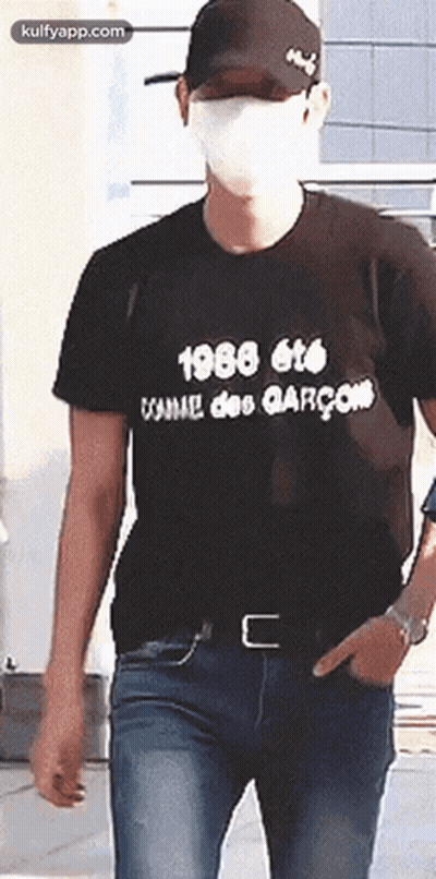 Man In Mask And Black T-Shirt Walking GIF
