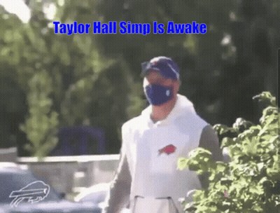 Man In Mask And Buffalo Bills Shirt Walking GIF