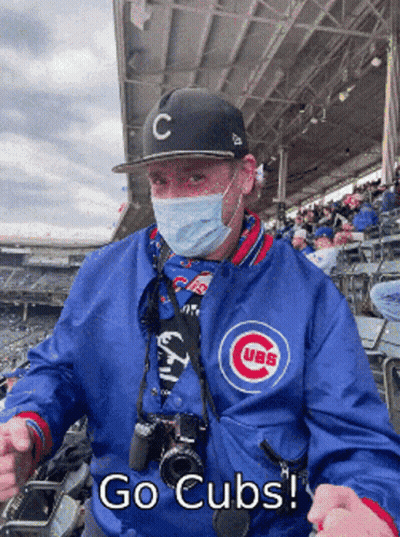 Man In Mask And Cubs Jacket GIF