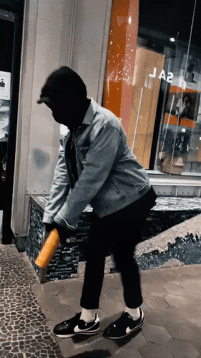 Man In Mask And Denim Jacket At Ja2 Store GIF