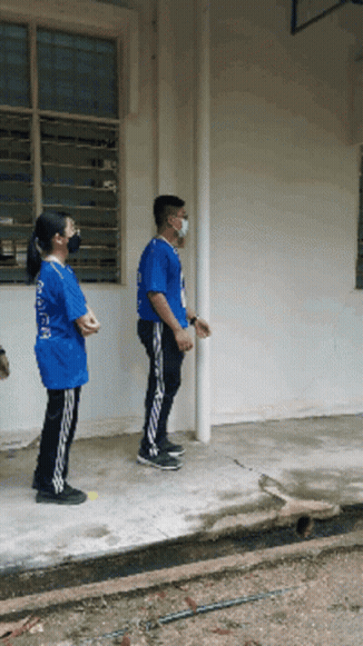 Man In Mask And Girl In Blue Shirt Saying A GIF