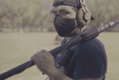 Man In Mask And Headphones Holding Microphone GIF