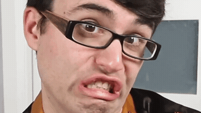 Man In Mask And Hoodie Standing In Front Of Door GIF