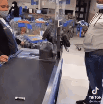 Man In Mask At Grocery Checkout Counter GIF