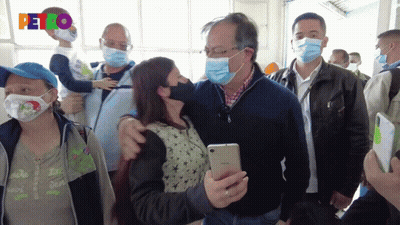 Man In Mask Holding Child GIF