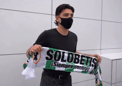 Man In Mask Holding Scarf Saying Solobetis GIF