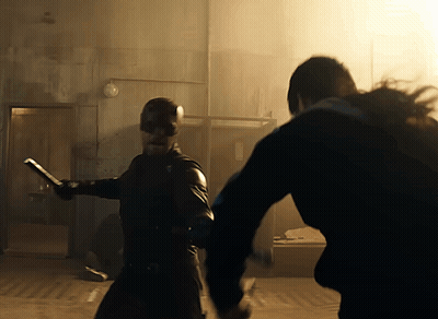 Man In Mask Holding Sword GIF