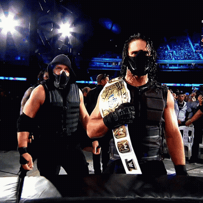 Man In Mask Holding Wrestling Belt GIF