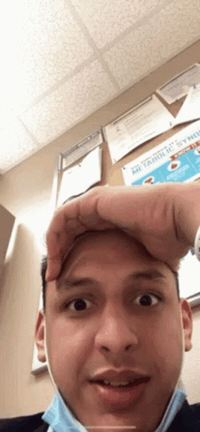 Man in Mask Making Funny Face Holding Forehead