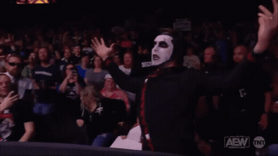 Man In Mask Says You're Cursed In Front Of Crowd GIF