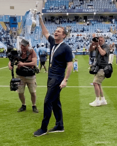 Man In Mask Shaking Hands In Front Of Audi Seats GIF
